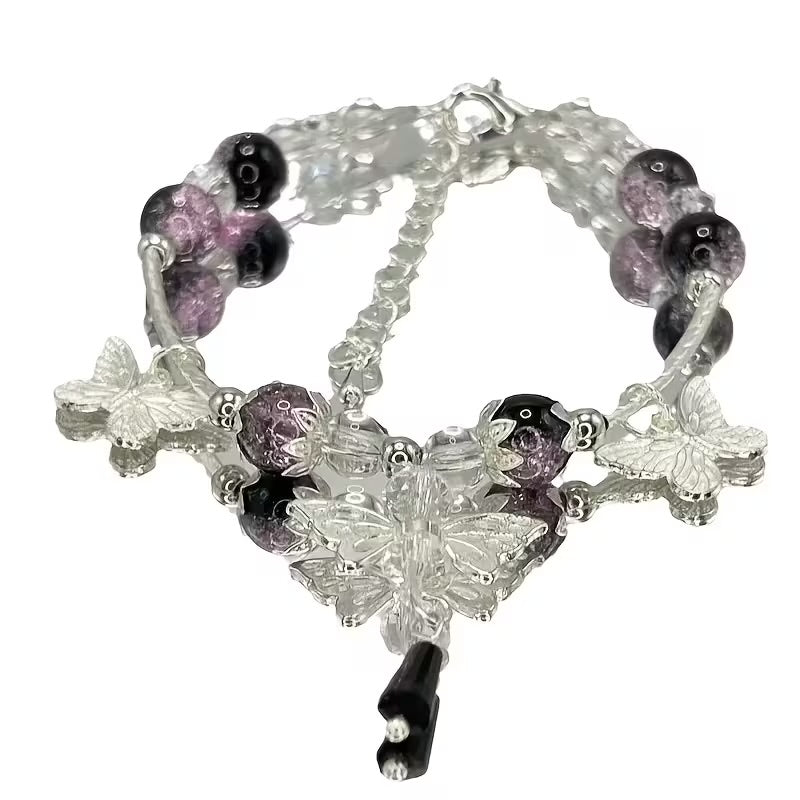 PULSERA PERLAS MORADAS MARIPOSA