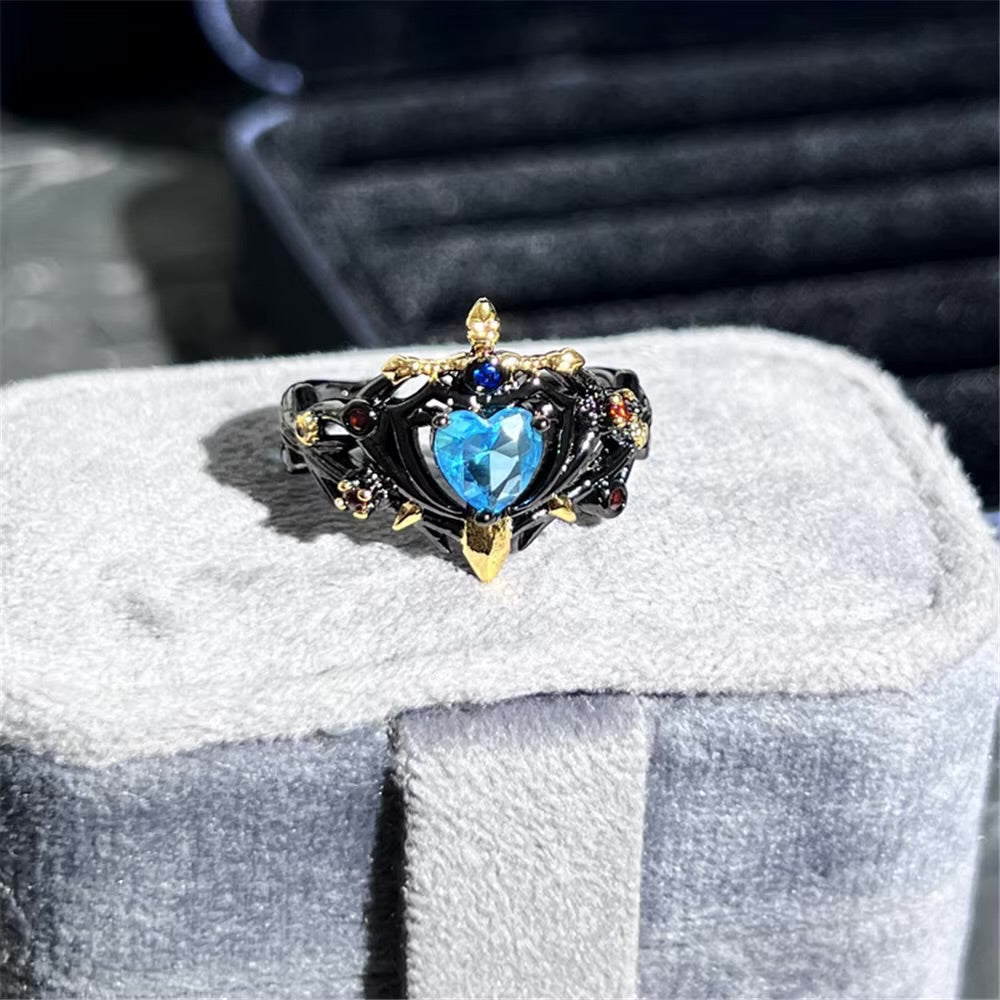ANILLO PERLA AZUL CON ESPADA