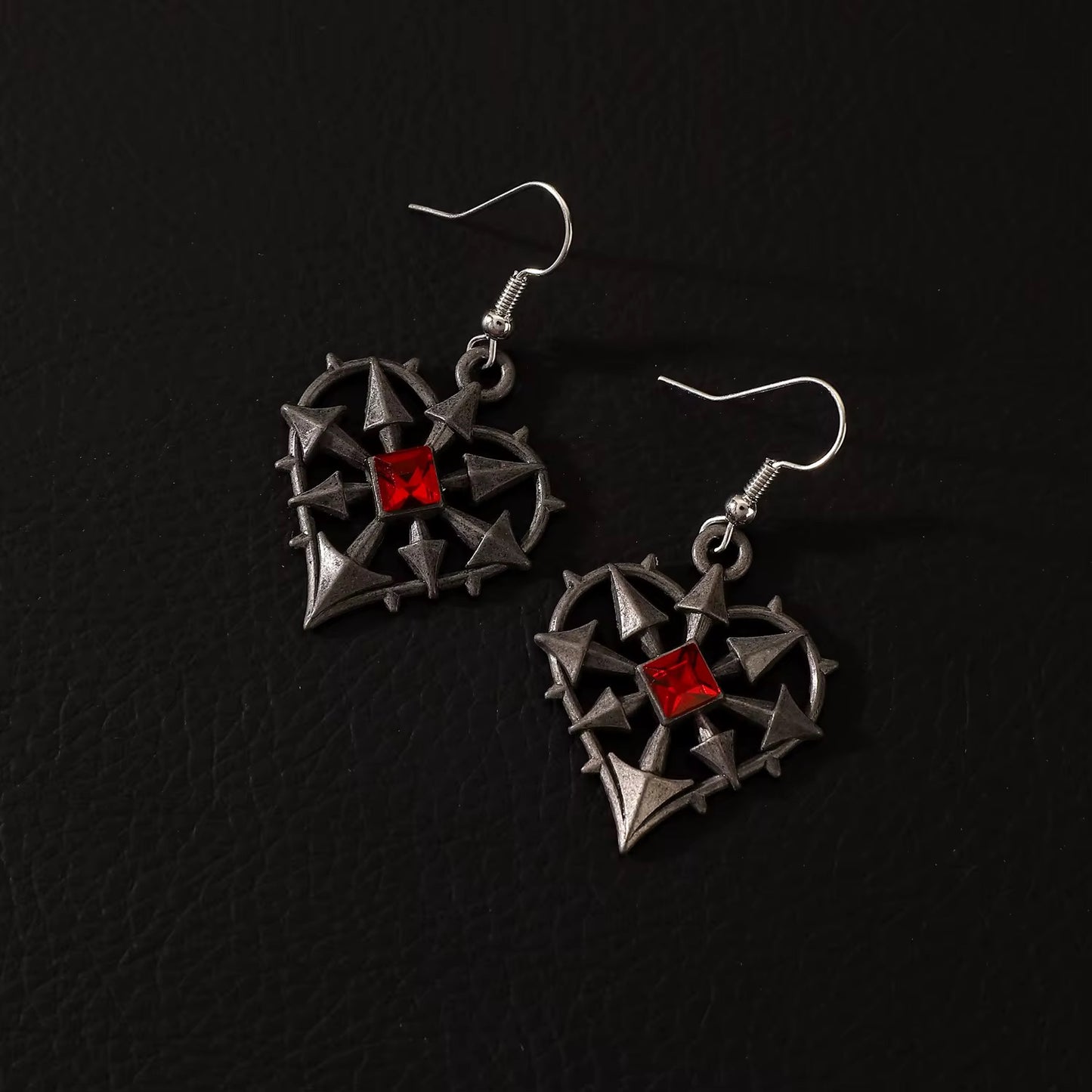 ARETES CORAZON ENCARCELADO
