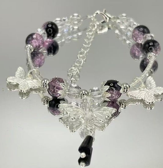 PULSERA PERLAS MORADAS MARIPOSA