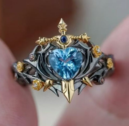 ANILLO PERLA AZUL CON ESPADA